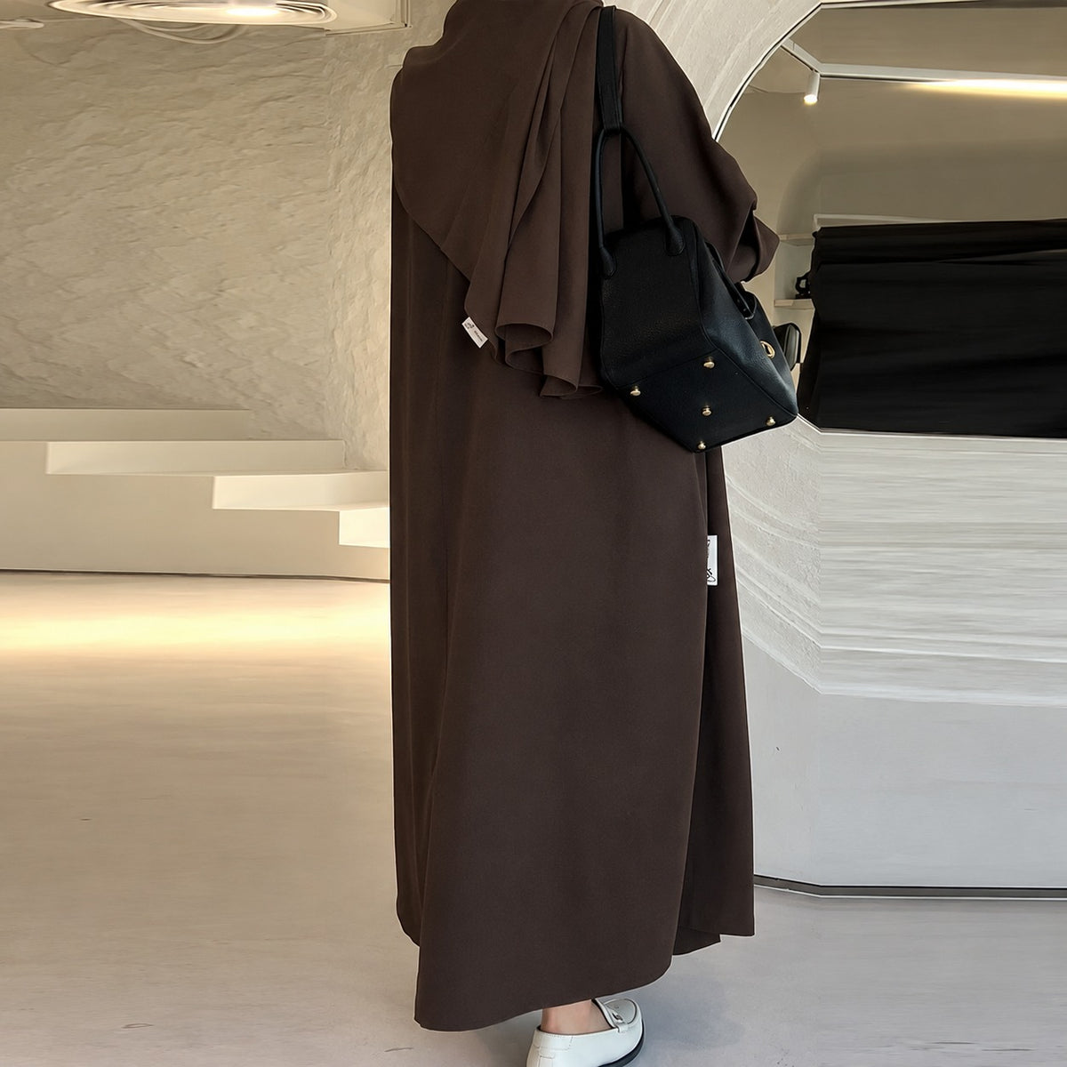 Dámský dlouhý kabát s oversized střih a zapínáním na knoflík, boční kapsy